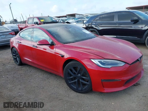 2021 Tesla Model S Plaid with VIN 5YJSA1E60MF447203, listed as a IAAI auction lot 42025120 with 58,190 mi miles. Bid and sale history available at carsss.com. Image 1.
