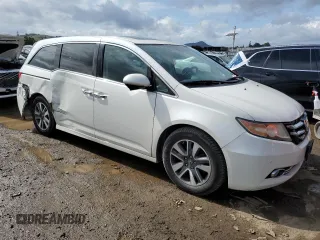 2014 Honda Odyssey Touring with VIN 5FNRL5H97EB097771, listed as a Copart auction lot 51664455 with 109,830 mi miles and Salvage Title. Bid and sale history available at DreamBid. Image 4.