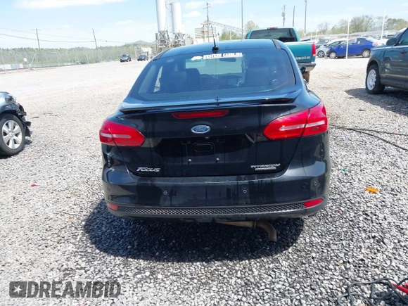 2016 Ford Focus Titanium z VIN 1FADP3J28GL393422, wystawiony jako IAAI lot #42075513 z przebiegiem 146 535 mil mil oraz . Historia ofert i sprzedaży dostępna na DreamBid. Obrazek 16.