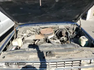 1991 Chevrolet Suburban z VIN 1GNGR26N2MF124400, wystawiony jako Copart lot #85809994 z przebiegiem 160 922 mil mil oraz Czysty tytuł • Clean title. Historia ofert i sprzedaży dostępna na DreamBid. Obrazek 12.