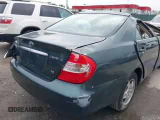 2002 Toyota Camry XLE z VIN 4T1BF32K02U522335, wystawiony jako IAAI lot #42037459 z przebiegiem 214 832 mil mil oraz . Historia ofert i sprzedaży dostępna na DreamBid. Obrazek 14.