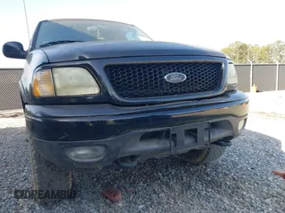 2003 Ford F-150 XL with VIN 2FTRX18L33CA96940, listed as a IAAI auction lot 42090248 with 229,260 mi miles. Bid and sale history available at carsss.com. Image 6.