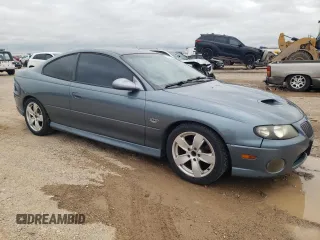 2006 Pontiac GTO z VIN 6G2VX12U06L550451, wystawiony jako Copart lot #54823105 z przebiegiem 273 049 mil mil oraz Tytuł czysty. Historia ofert i sprzedaży dostępna na DreamBid. Obrazek 4.