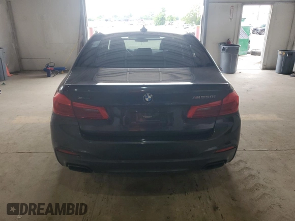 2018 BMW 5 Series M550i xDrive with VIN WBAJB9C58JB035267, listed as a Copart auction lot 64616605 with 125,365 mi miles and Clean title. Bid and sale history available at DreamBid. Image 6.