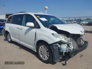 2015 Toyota Sienna XLE with VIN 5TDYK3DC0FS537542, listed as a IAAI auction lot 41578232 with 125,007 mi miles. Bid and sale history available at carsss.com. Image 1.