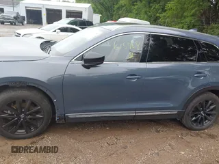 2022 Mazda CX-9 Grand Touring with VIN JM3TCBDY0N0615968, listed as a IAAI auction lot 42312159 with 22,912 mi miles and . Bid and sale history available at DreamBid. Image 14.