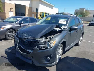 2014 Mazda CX-5 Grand Touring with VIN JM3KE4DY8E0391317, listed as a IAAI auction lot 41871641 with 77,048 mi miles. Bid and sale history available at carsss.com. Image 20.