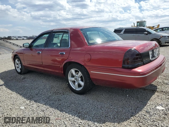 2003 Ford Crown Victoria LX z VIN 2FAFP74W43X100336, wystawiony jako Copart lot #51004035 z przebiegiem 82 089 mil mil oraz Szkoda całkowita • Salvage title. Historia ofert i sprzedaży dostępna na DreamBid. Obrazek 2.