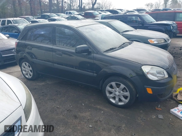 2009 Kia Rio LX with VIN KNADE243296481394, listed as a IAAI auction lot 41498863 with 59,222 mi miles. Bid and sale history available at carsss.com. Image 1.