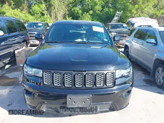 2017 Jeep Grand Cherokee Laredo with VIN 1C4RJFAGXHC817666, listed as a IAAI auction lot 42036817 with 119,698 mi miles. Bid and sale history available at carsss.com. Image 6.