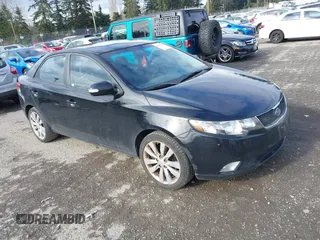 2010 Kia Forte SX with VIN KNAFW4A39A5054469, listed as a IAAI auction lot 41526636 with 115,008 mi miles. Bid and sale history available at carsss.com. Image 1.