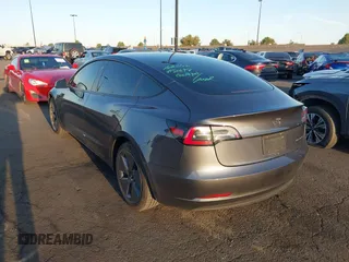 2021 Tesla Model 3 Long Range with VIN 5YJ3E1EBXMF995814, listed as a IAAI auction lot 41838453 with 51,415 mi miles. Bid and sale history available at carsss.com. Image 3.