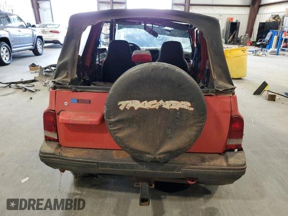1994 Geo Tracker z VIN 2CNBE18U3R6952403, wystawiony jako Copart lot #79038524 z przebiegiem 271 461 mil mil oraz Szkody całkowita. Historia ofert i sprzedaży dostępna na DreamBid. Obrazek 6.