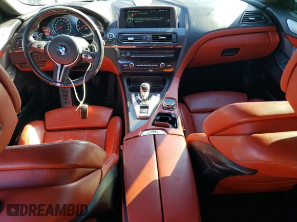 2015 BMW M6 z VIN WBS6C9C5XFD467854, wystawiony jako Copart lot #78871744 z przebiegiem 55 789 mil mil oraz Szkody całkowita. Historia ofert i sprzedaży dostępna na DreamBid. Obrazek 8.