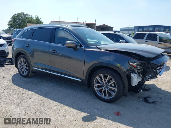 2020 Mazda CX-9 Grand Touring z VIN JM3TCADY8L0417775, wystawiony jako IAAI lot #42306864 z przebiegiem 35 287 mil mil oraz . Historia ofert i sprzedaży dostępna na DreamBid. Obrazek 1.