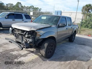 2004 Nissan Frontier XE z VIN 1N6ED27T84C446582, wystawiony jako IAAI lot #41428931 z przebiegiem Nie podano mil oraz . Historia ofert i sprzedaży dostępna na DreamBid. Obrazek 2.