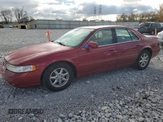 1999 Cadillac Seville Touring STS z VIN 1G6KY5490XU919543, wystawiony jako Copart lot #77068624 z przebiegiem 142 772 mil mil oraz Szkoda całkowita • Salvage title. Historia ofert i sprzedaży dostępna na DreamBid. Obrazek 1.