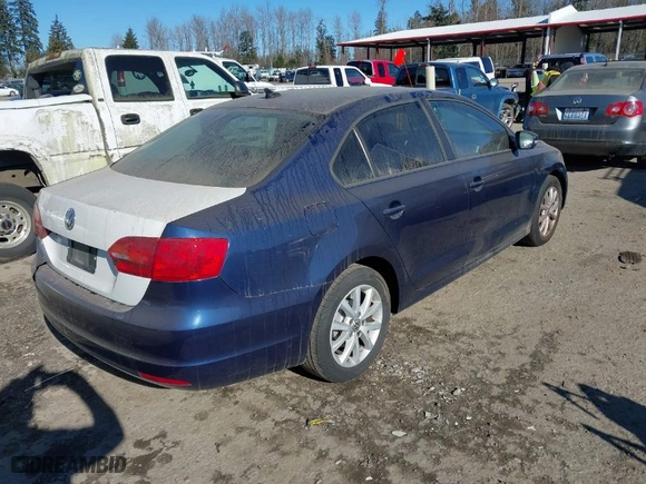 2011 Volkswagen Jetta Sedan SE w/Convenience & Sunroof with VIN 3VWDX7AJ3BM321590, listed as a IAAI auction lot 41573649 with NaN miles. Bid and sale history available at carsss.com. Image 4.