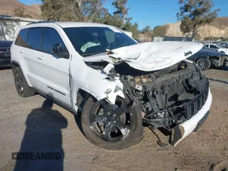 2018 Jeep Grand Cherokee Laredo E with VIN 1C4RJFAGXJC353073, listed as a IAAI auction lot 41380622 with 85,365 mi miles. Bid and sale history available at carsss.com. Image 1.