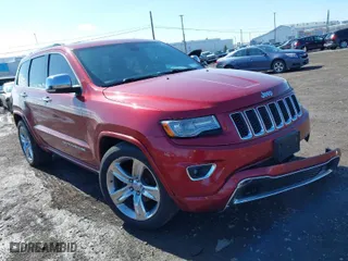 2014 Jeep Grand Cherokee Overland with VIN 1C4RJFCG2EC216406, listed as a IAAI auction lot 41944794 with 124,007 mi miles. Bid and sale history available at carsss.com. Image 1.