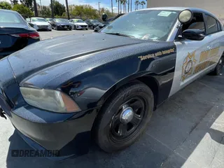 2012 Dodge Charger Police with VIN 2C3CDXAG0CH295515, listed as a Copart auction lot 51870315 with 128,837 mi miles and Clean Title. Bid and sale history available at carsss.com. Image 2.