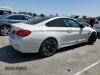 2015 BMW M4 with VIN WBS3R9C51FK334414, listed as a Copart auction lot 52451035 with 122,436 mi miles and Salvage title. Bid and sale history available at DreamBid. Image 3.