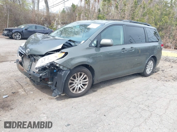 2012 Toyota Sienna XLE AAS with VIN 5TDYK3DC1CS199113, listed as a IAAI auction lot 42123757 with 211,723 mi miles and . Bid and sale history available at carsss.com. Image 2.