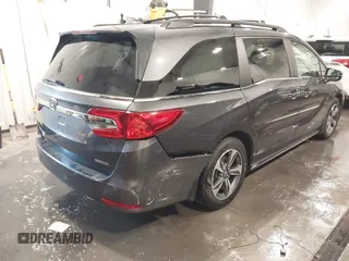 2018 Honda Odyssey Touring with VIN 5FNRL6H84JB041309, listed as a IAAI auction lot 42272247 with 90,371 mi miles and . Bid and sale history available at DreamBid. Image 6.