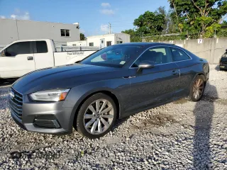 2018 Audi A5 Premium z VIN WAUNNAF55JA016977, wystawiony jako Copart lot #78208494 z przebiegiem 66 000 mil mil oraz Szkoda całkowita • Salvage title. Historia ofert i sprzedaży dostępna na DreamBid. Obrazek 1.