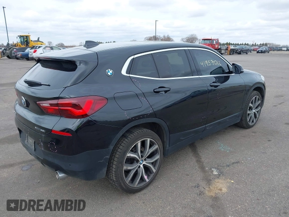2020 BMW X2 xDrive28i with VIN WBXYJ1C02L5R71755, listed as a IAAI auction lot 41957012 with 69,997 mi miles. Bid and sale history available at carsss.com. Image 4.