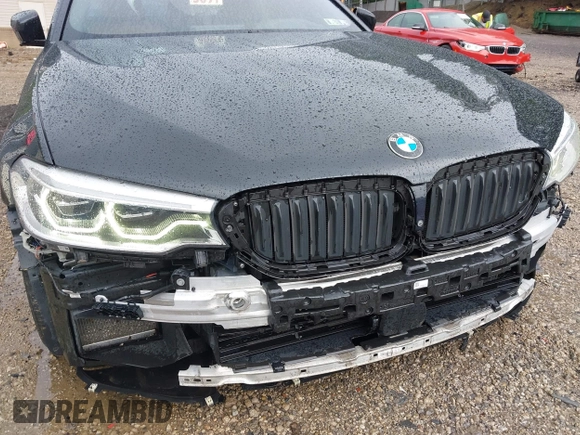2018 BMW 5 Series M550i xDrive with VIN WBAJB9C5XJB286923, listed as a IAAI auction lot 42527301 with 76,923 mi miles and . Bid and sale history available at DreamBid. Image 18.