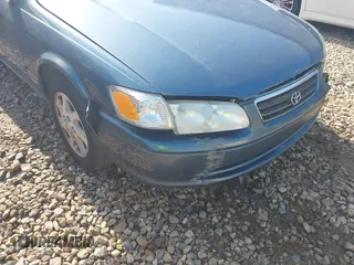 2000 Toyota Camry CE z VIN JT2BG22K5Y0476098, wystawiony jako IAAI lot #42200385 z przebiegiem Nie podano mil oraz . Historia ofert i sprzedaży dostępna na DreamBid. Obrazek 12.