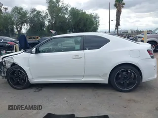 2014 Scion tC with VIN JTKJF5C79E3075707, listed as a IAAI auction lot 41557310 with 132,468 mi miles. Bid and sale history available at carsss.com. Image 15.