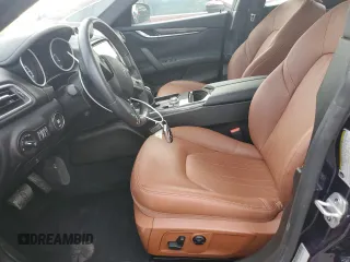 2018 Maserati Ghibli z VIN ZAM57XSA5J1287424, wystawiony jako Copart lot #71215154 z przebiegiem 20 029 mil mil oraz Szkoda całkowita • Salvage title. Historia ofert i sprzedaży dostępna na DreamBid. Obrazek 7.
