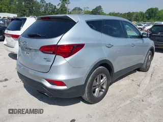 2018 Hyundai Santa Fe 2.4L z VIN 5XYZTDLB9JG513584, wystawiony jako IAAI lot #42031291 z przebiegiem 131 109 mil mil oraz . Historia ofert i sprzedaży dostępna na DreamBid. Obrazek 4.