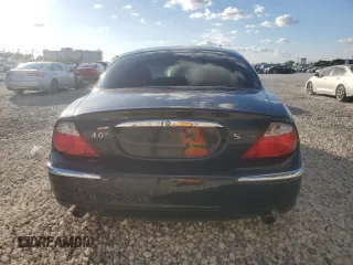 2000 Jaguar S-Type V8 z VIN SAJDA01D4YGL61655, wystawiony jako Copart lot #85873054 z przebiegiem 85 239 mil mil oraz Nie do naprawy • Non repairable. Historia ofert i sprzedaży dostępna na DreamBid. Obrazek 6.
