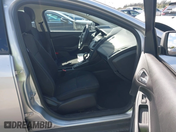 2018 Ford Focus SE z VIN 1FADP3FE3JL220529, wystawiony jako IAAI lot #41564216 z przebiegiem 16 883 mil mil oraz . Historia ofert i sprzedaży dostępna na DreamBid. Obrazek 5.