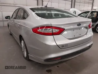 2013 Ford Fusion SE Hybrid with VIN 3FA6P0LU7DR228691, listed as a IAAI auction lot 42055540 with 144,389 mi miles and . Bid and sale history available at DreamBid. Image 3.