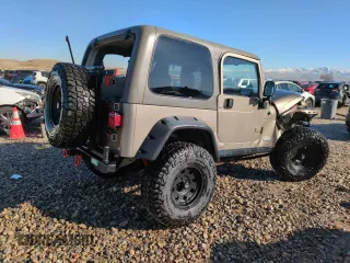 2004 Jeep Wrangler Rubicon with VIN 1J4FA69S14P749749, listed as a Copart auction lot 44458485 with 99,121 mi miles and Salvage Title. Bid and sale history available at carsss.com. Image 3.