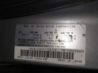 2012 Mazda 3 i Sport with VIN JM1BL1UGXC1506740, listed as a IAAI auction lot 41391664 with 179,450 mi miles and . Bid and sale history available at DreamBid. Image 9.