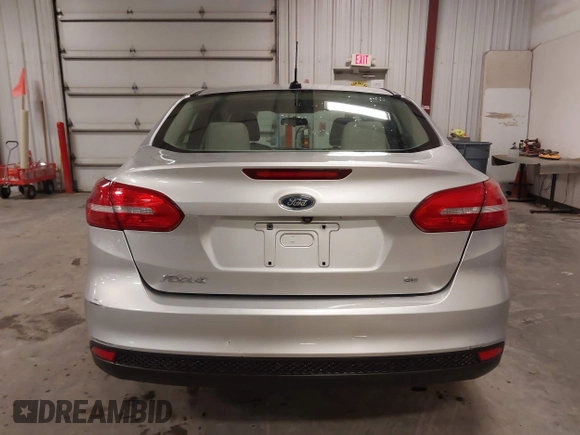 2017 Ford Focus SE z VIN 1FADP3F20HL245291, wystawiony jako IAAI lot #42194880 z przebiegiem 93 764 mil mil oraz . Historia ofert i sprzedaży dostępna na DreamBid. Obrazek 16.