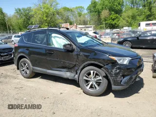 2018 Toyota RAV4 XLE with VIN 2T3WFREVXJW471443, listed as a Copart auction lot 54890655 with 131,677 mi miles and Salvage title. Bid and sale history available at DreamBid. Image 4.