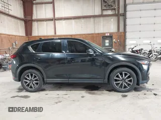 2017 Mazda CX-5 Grand Touring with VIN JM3KFBDL6H0143013, listed as a IAAI auction lot 41912979 with 122,890 mi miles. Bid and sale history available at carsss.com. Image 13.