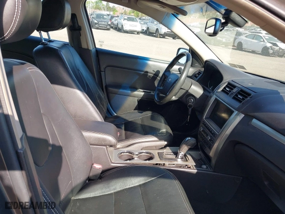 2011 Ford Fusion Hybrid with VIN 3FADP0L34BR290335, listed as a IAAI auction lot 42094674 with 171,391 mi miles. Bid and sale history available at carsss.com. Image 5.