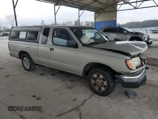 1999 Nissan Frontier XE with VIN 1N6DD26SXXC344449, listed as a Copart auction lot 43748015 with 137,318 mi miles and Salvage title. Bid and sale history available at DreamBid. Image 4.