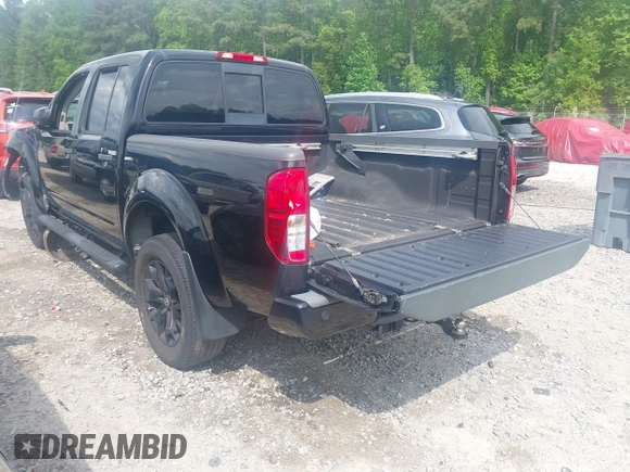 2018 Nissan Frontier SV with VIN 1N6AD0EV0JN744891, listed as a IAAI auction lot 42128481 with 137,412 mi miles and . Bid and sale history available at DreamBid. Image 3.