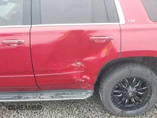 2015 Chevrolet Tahoe LTZ z VIN 1GNSKCKC6FR276531, wystawiony jako IAAI lot #41692617 z przebiegiem 124 010 mil mil oraz . Historia ofert i sprzedaży dostępna na DreamBid. Obrazek 17.