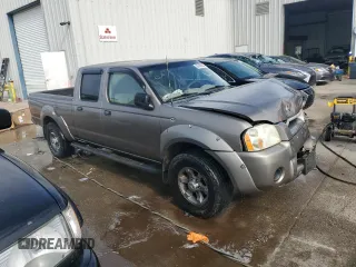 2004 Nissan Frontier XE with VIN 1N6ED29X24C455875, listed as a Copart auction lot 88430605 with 228,936 mi miles and Salvage title. Bid and sale history available at DreamBid. Image 4.