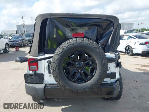 2015 Jeep Wrangler Willys Wheeler with VIN 1C4AJWAG0FL562536, listed as a IAAI auction lot 42384747 with 103,507 mi miles and . Bid and sale history available at DreamBid. Image 16.