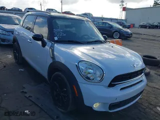 2015 MINI Cooper Countryman S with VIN WMWZC3C5XFWT06360, listed as a IAAI auction lot 40774863 with 127,383 mi miles. Bid and sale history available at carsss.com. Image 1.